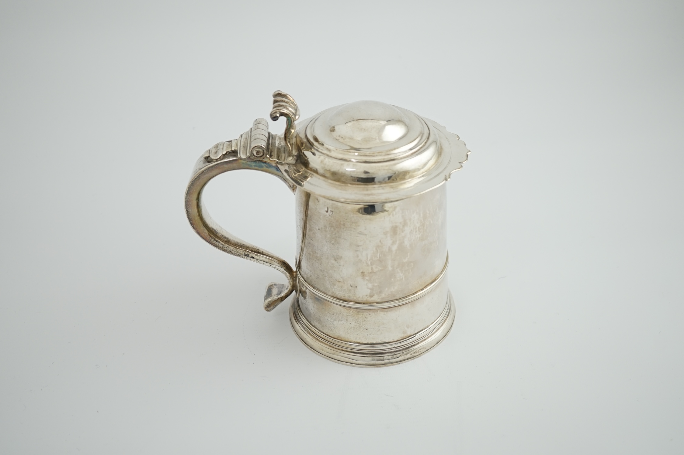 A late Queen Anne Britannia standard silver tankard, maker R?